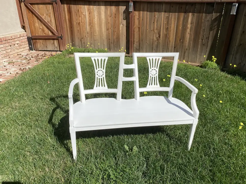 White-painted two-seat bench built from a pair of antique chair backs
