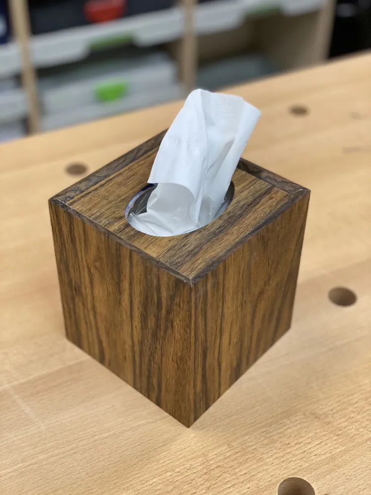 Shedua cube tissue-box cover on a workbench