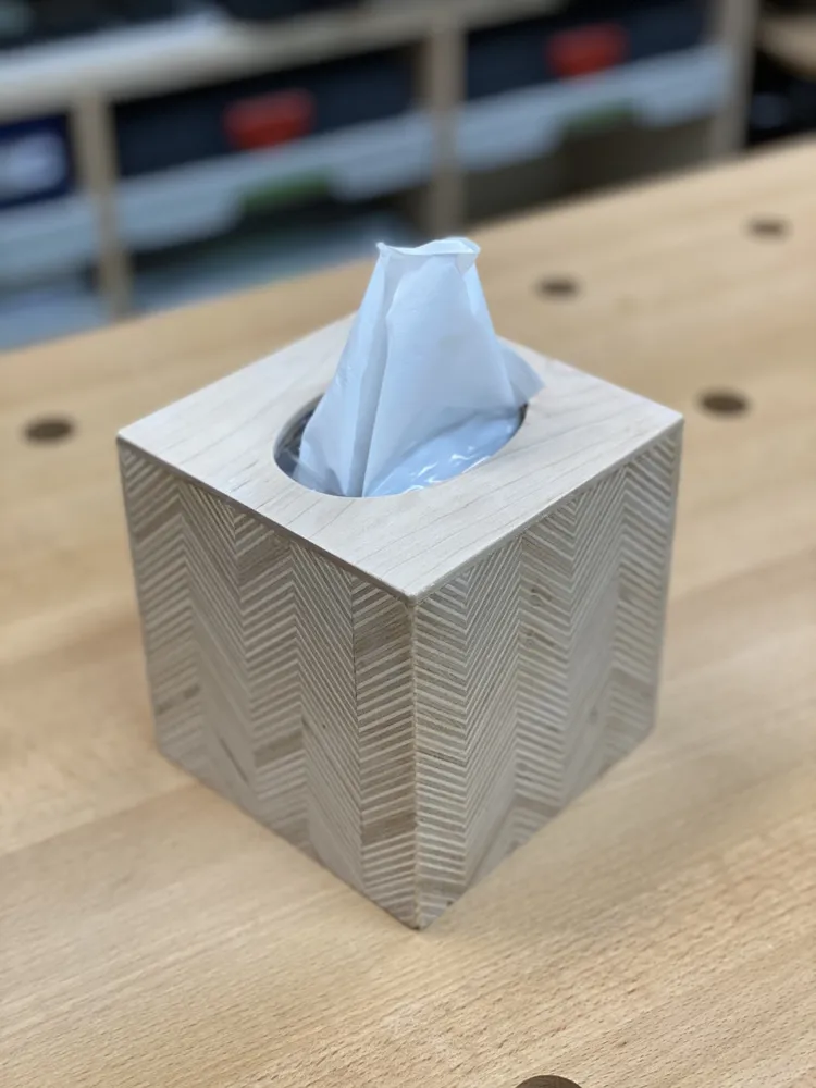 Herringbone-patterned plywood cube tissue-box cover
