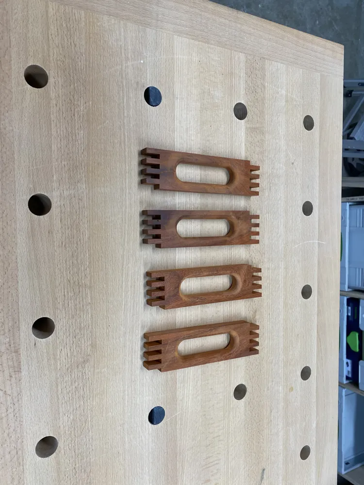 Four pierced padauk pieces for the roof ridge